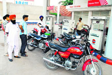 Peeved customers at an Indian Oil petrol station in Goniana Mandi (Bathinda) due to unavailability of petrol on Wednesday.