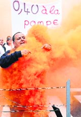 A fisherman sets himself on fire during a protest in front of the European Commission headquarters in Brussels