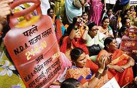 Activists of Opposition, the BJP, raise anti-government slogans protesting against a hike in fuel prices in Mumbai.