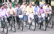 Panjab University VC Prof R.C. Sobti and senior officials and PU staff participate in a cycle rally on World Environment Day in Chandigarh on Thursday.
