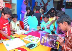 Kids read at the childrens' section of the Dyal Singh Library in New Delhi. The section was inaugurated on Thursday.