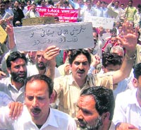 Members of the Jammu and Kashmir coordination committee of the All-India Trade Union Congress protesting against the price hike in Srinagar