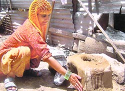With steep hike in the price of LPG cylinders, people in Kashmir have reverted to the traditional earthen chullah, using wood as fuel