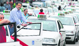 Taxi drivers take part in a protest against high fuel prices in downtown Madrid on Thursday.