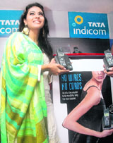 Actress Kajol poses during the launch of a cordless phone at a Tata Indicom outlet in New Delhi on Friday.