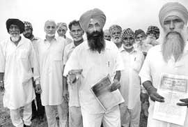 Farmers protest against the Punjab government at Jheorheri village, near Chandigarh, on Friday. 