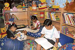 Kids busy reading in the children section of Central Library, Sector-17. 