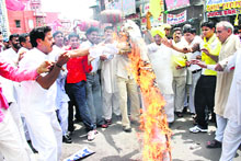 Activists of the Haryana Janhit Congress stage a demonstration in Rohtak on Friday against the petro price hike.