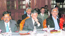 ijay Kelkar, chairman of the 13th Finance Commission (centre), at a meeting with state officials in Shimla