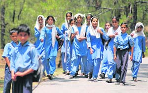Children return home from schools after the government declared summer holidays in all schools in the state from June 7.