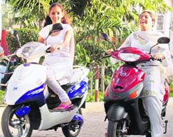 Students ride two-wheelers in Ludhiana. 