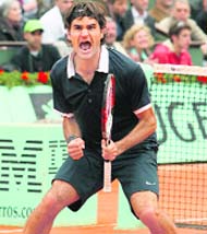 Switzerland's Roger Federer celebrates after defeating France's Gael Monfils during their semi-final match at the French Open on Friday. Federer won 6-2 5-7 6-3 7-5. 