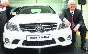 Managing director and CEO of Mercedes-Benz India, Wilfried Aulbur poses at the launch of the Mercedes-Benz C 63 AMG sports car in Mumbai on Saturday. The C 63 AMG accelerates from zero to 100 km/h in just 4.5 seconds with high technology and is priced at Rs 78.22 lakh.