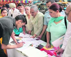 Serving and retired defence personnel and their family members register at a lifestyle diseases awareness camp organised on the occasion of the 48th Raising Day of Command Hospital at Chandi Mandir on Saturday.