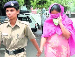 Vickys wife Neeru being produced in a local court in Chandigarh on Saturday. 