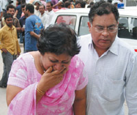The mourning relatives of the Maini family in Noida on Saturday.