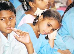 ENDLESS WAIT: Students were made to sit for hours during a function at the Government Higher Secondary School for Girls in Jammu on Saturday.