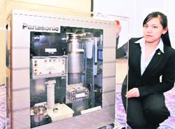 This file photo shows Japan's electronics giant Matsushita Electric Industrial's new fuel cell cogeneration system for home use in Tokyo. The fuel cells produce electricity and hot water through a chemical reaction between oxygen and hydrogen extracted from natural gas or other fuels. As world oil prices skyrocket, thousands of households in energy-poor Japan are taking part in an ambitious experiment to use fuel cells to light and heat their homes.