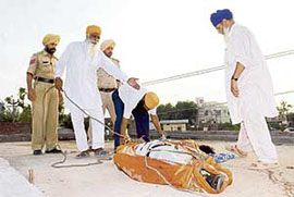 The bodies of the victims being removed after they were electrocuted at Rajpura on Sunday.