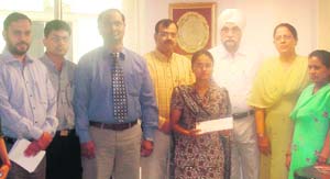 Shilpi receives a cash award from the SPS Apollo Hospitals management in Ludhiana.