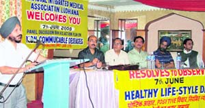 Dr Parminder Singh speaks during a panel discussion on non-communicable diseases organised by NIMA in Ludhiana on Saturday.