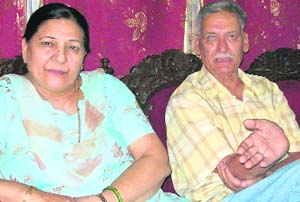 Capt Janmej Singh (retd) and Pushap Lata, parents of martyr Lt Triveni Singh, at their residence in Pathankot on Sunday.
