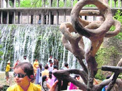 Tourists enjoy waterfall site at Rock Garden in Chandigarh