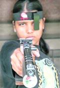An NCC cadet takes aim with a pistol during a talent scouting-cum-coaching camp for marksmanship in Chandigarh 
