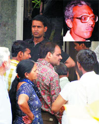 Relatives of Anil Sharma (inset) at his residence in Shalimar Park in New Delhi on Monday.