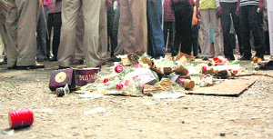 Broken bottles on the road after a mob removed a liquor vend in Ludhiana on Monday.