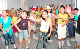 Students of Guru Nanak International Public School dance during a summer camp in Ludhiana on Monday.