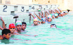 Swimmers get ready for the practice session in Ludhiana on Monday.