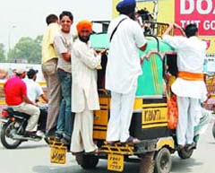 Beasts of Burden: Overloaded autorickshaws are a common sight in the city.