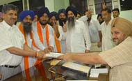 SAD (B) candidates (left) filing their nominations