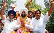 Jagtar Singh, an independent candidate from ward No. 42 greets his supporters before filing his nomination on Tuesday.