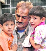 Jagbir with his granddaughters