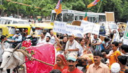 Bharatiya Janata Party activists protest against the rise in the prices of essential commodities in New Delhi
