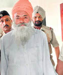 Labh Singh Mann in police custody at the Sector 31 police station in Chandigarh.