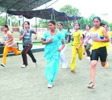 Candidates appear in a physical fitness test at BSF headquarters in Jalandhar on Wednesday. 