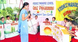 Students participate in a quiz contest at Kiddies Paradise in Ludhiana on Wednesday. 