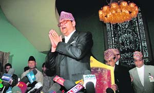 King Gyanendra gestures towards media  representatives before addressing a press conference at Naryanhiti Palace in Kathmandu on Wednesday. Nepal's ousted King Gyanendra said in an address to the nation that he "respected" a decision to abolish his Himalayan monarchy.