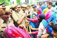 Members of the families of the two dismissed policemen, accompanied by villagers, make an attempt to barge into the Police Lines to meet the SP on Thursday.