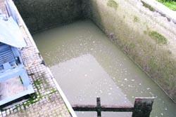 A view of a filthy IPH filter tank in Palampur