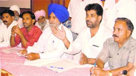 Ramanjit Badhan (2nd from right), state general secretary of the BSP, addresses a press conference in Ludhiana on Thursday