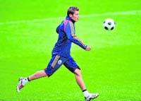 Romanias Adrian Mutu runs for the ball during a training session on the eve of their Euro 2008 match against Italy, at AFG Arena stadium on Thursday in St.Gallen. 