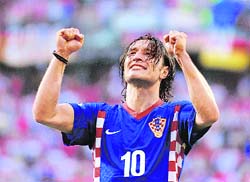 Croatian midfielder Niko Kovac celebrates after his team defeated Germany in their Group B match on Thursday at Woerthersee stadium in Klagenfurt, Austria.  AFP