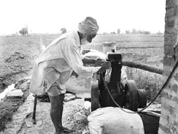A farmer powers up a diesel-run generator in Adampur village, Fatehgarh Sahib, on Friday. 