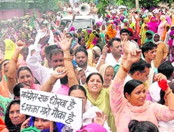 The workers of INLD taking out a protest march at Panchkula on Friday. 