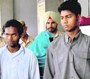 Anand Kindo (right), Rajan Gond and Sandhya (face covered)