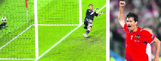 Poland's goalkeeper Artur Boruc dives in vain as Austria's Ivica Vastic (R) penalty goes into the goal net during the Group B Euro 2008 soccer match at the Ernst Happel Stadium in Vienna, on Thursday.  Reuters